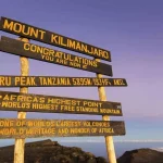 Are Cross-Border Flights Between Kigali and Kilimanjaro or Seronera Included in Standard Packages?